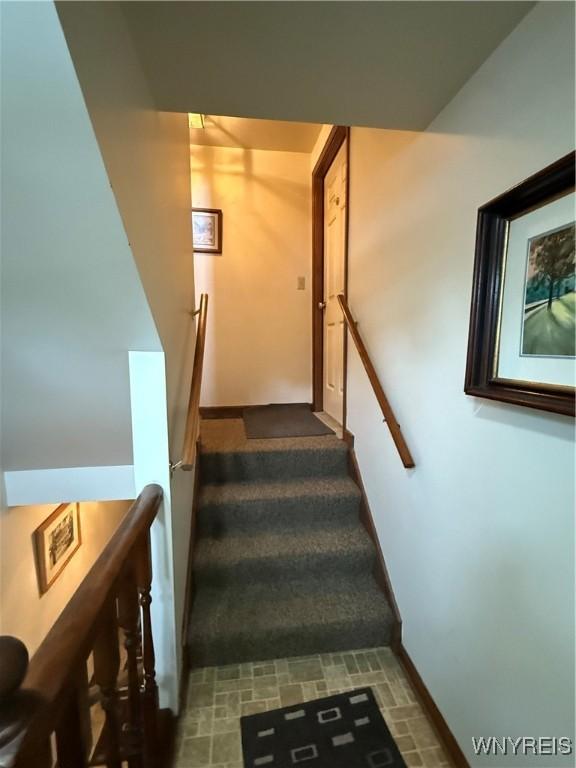 stairway with baseboards