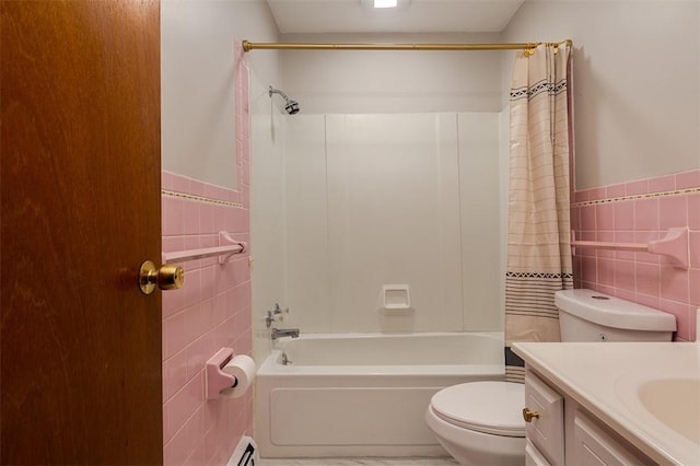 full bath featuring toilet, vanity, tile walls, and shower / tub combo with curtain