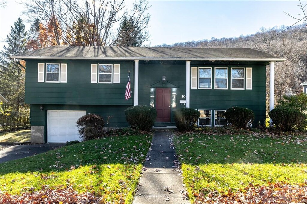 10 Grannan Dr, Corning-City, NY 14830 - bi-level home with an attached garage, aphalt driveway, and a front yard