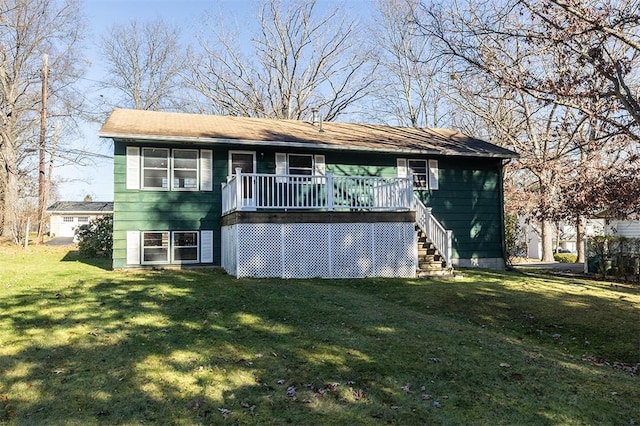 view of front facade with stairway and a front yard