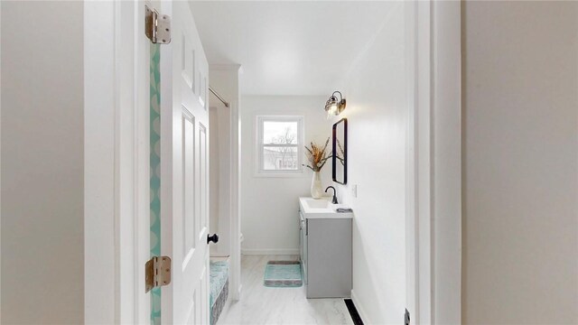 bathroom with vanity and baseboards