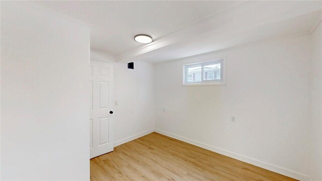 unfurnished room featuring light wood-style flooring and baseboards