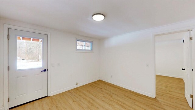 interior space with light wood-style flooring and baseboards