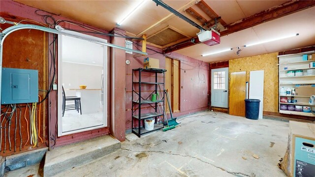 interior space with a garage and electric panel