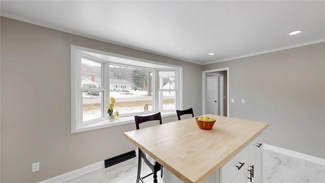 dining room with recessed lighting, marble finish floor, and baseboards