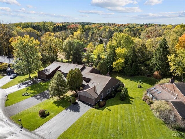 aerial view featuring a wooded view