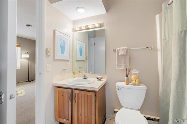 bathroom featuring a baseboard radiator, visible vents, vanity, and toilet