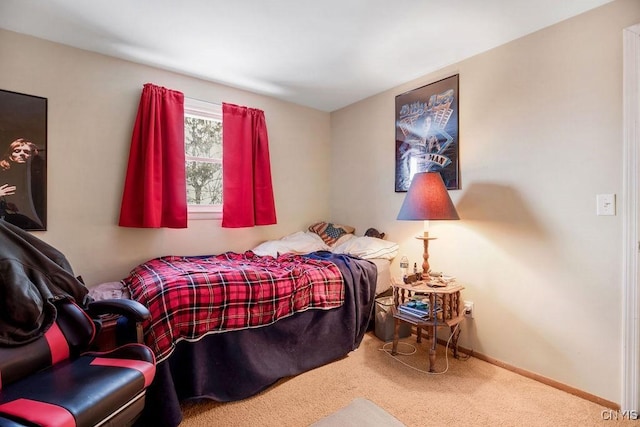 carpeted bedroom with baseboards