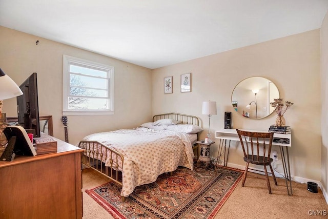 carpeted bedroom with baseboards