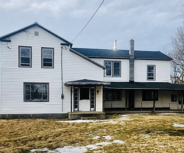 view of front of house featuring a chimney