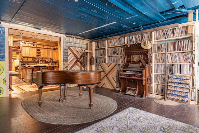 sitting room with wood-type flooring and wooden ceiling