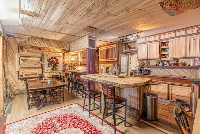 kitchen featuring light wood-style floors, wood ceiling, wooden counters, and open shelves