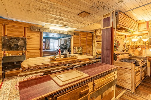 kitchen with wood ceiling, wood walls, and wood-type flooring