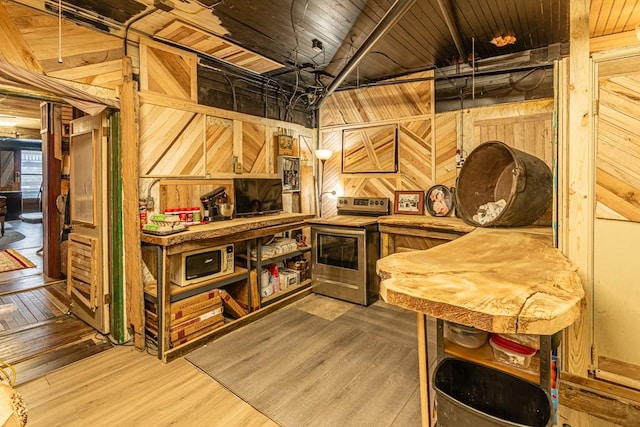 interior space with wood ceiling, wood walls, and wood finished floors