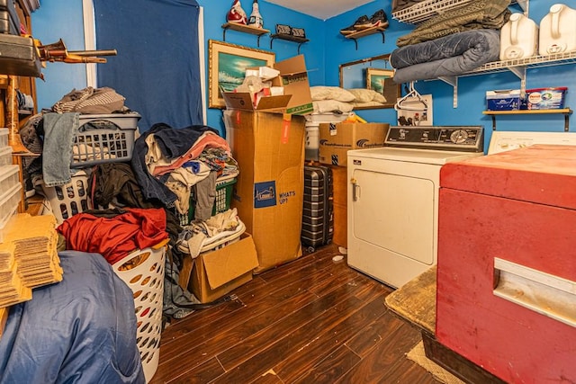 laundry area with washing machine and dryer, laundry area, and wood finished floors