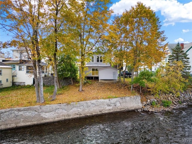 view of front facade with a water view