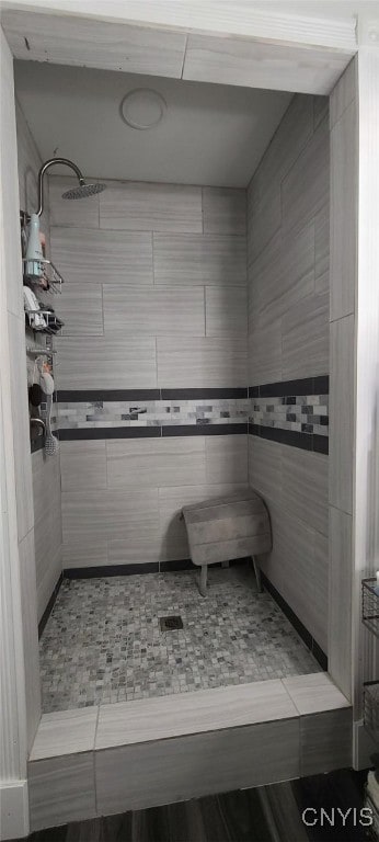 full bathroom with a sauna and tiled shower