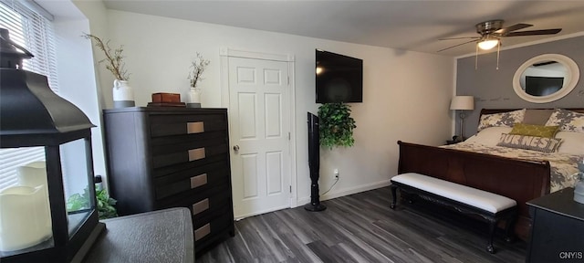 bedroom with ceiling fan, multiple windows, dark wood-style flooring, and baseboards