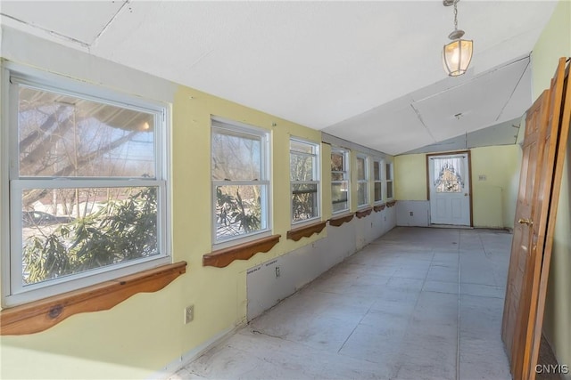 sunroom with a wealth of natural light and vaulted ceiling