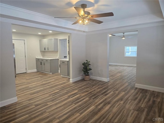 unfurnished room with ornamental molding, recessed lighting, dark wood-style flooring, and baseboards