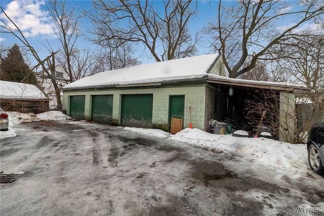 view of snow covered garage