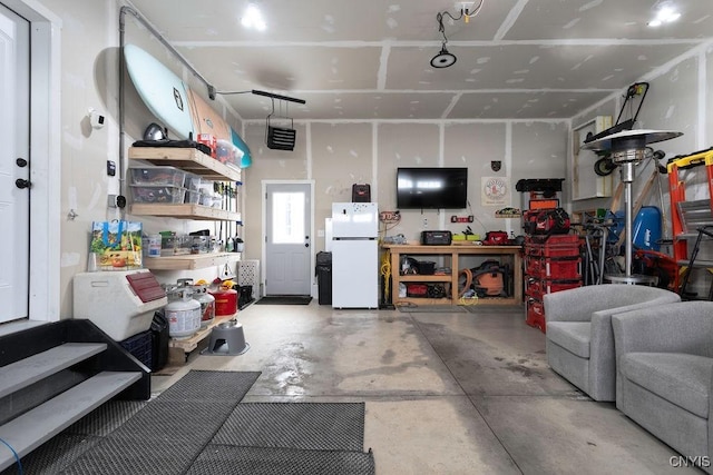 garage with freestanding refrigerator