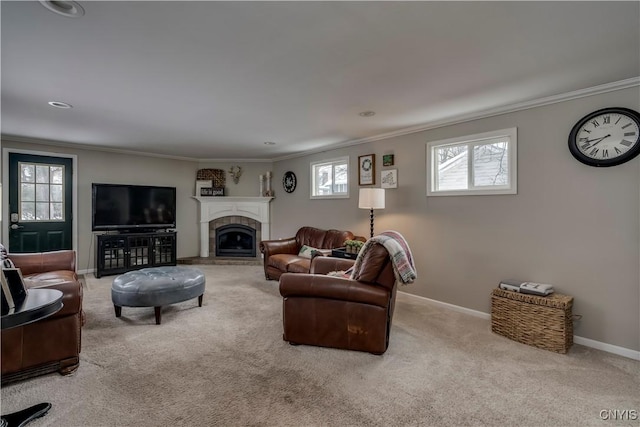 carpeted living room featuring baseboards, crown molding, and a glass covered fireplace