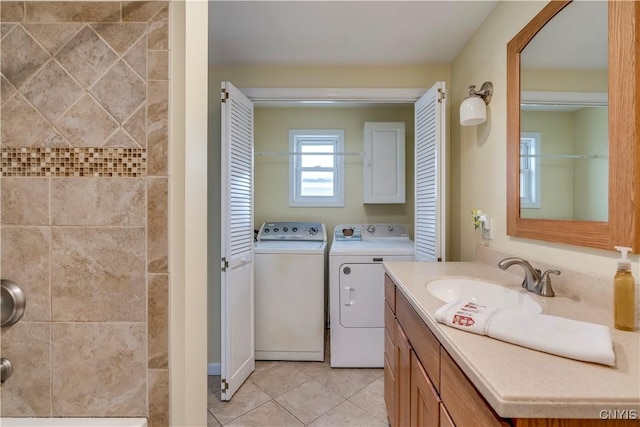 full bath featuring a shower, tile patterned flooring, vanity, and washer and dryer