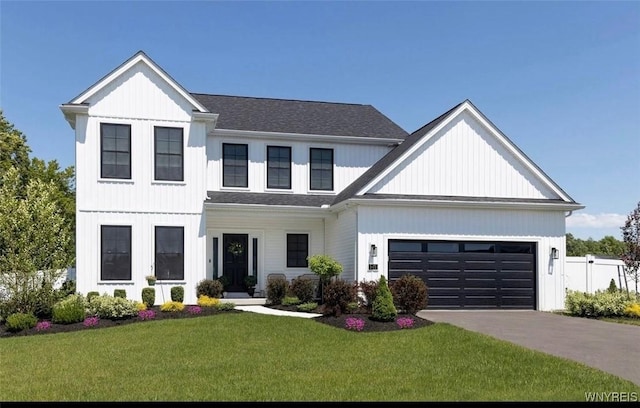 modern farmhouse featuring driveway, a garage, roof with shingles, fence, and a front yard