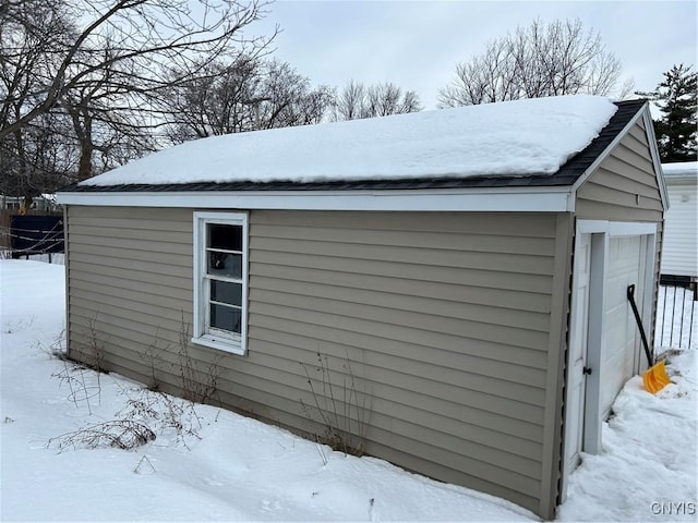 snow covered structure with an outdoor structure