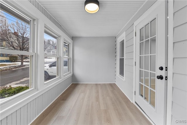 unfurnished sunroom with plenty of natural light