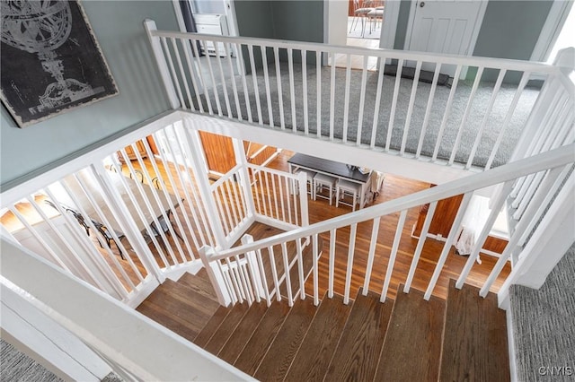 stairs with wood finished floors