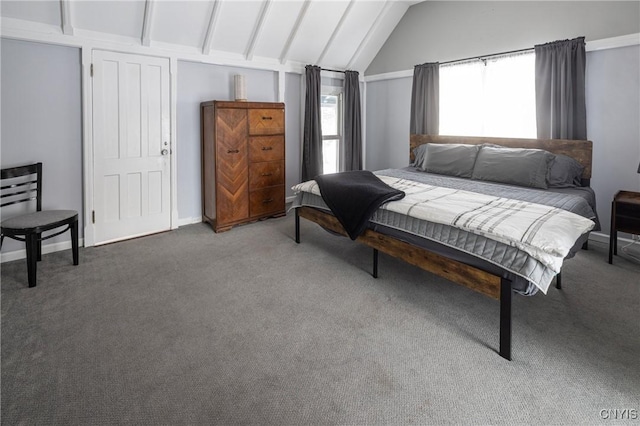 bedroom with lofted ceiling, baseboards, and carpet