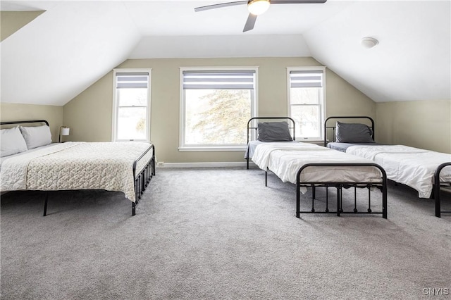 bedroom with carpet floors, lofted ceiling, baseboards, and a ceiling fan