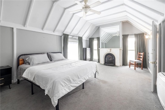 carpeted bedroom with lofted ceiling and a ceiling fan