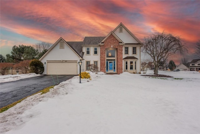 view of front facade with driveway and an attached garage