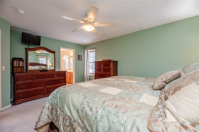 bedroom featuring baseboards, a ceiling fan, and light colored carpet