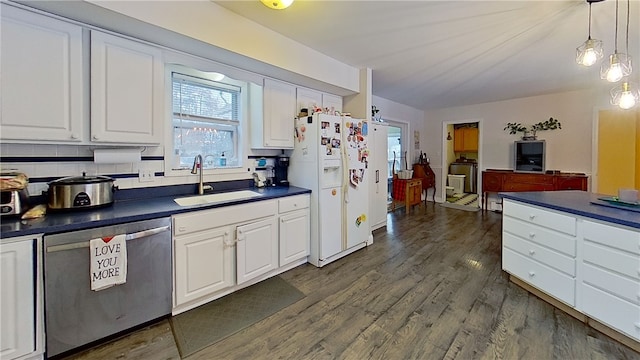 kitchen featuring dishwasher, dark countertops, white fridge with ice dispenser, white cabinetry, and a sink