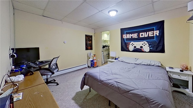 bedroom featuring carpet floors, a baseboard radiator, and a paneled ceiling