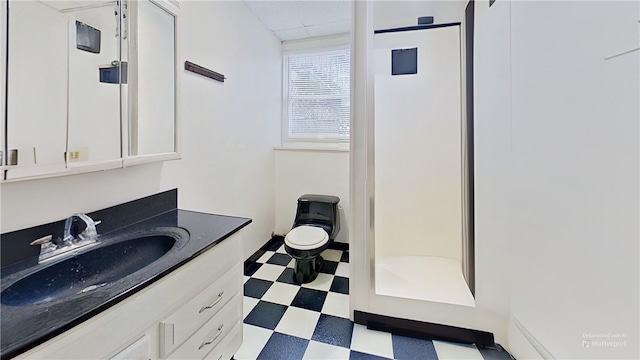 full bathroom with vanity, a shower stall, and tile patterned floors