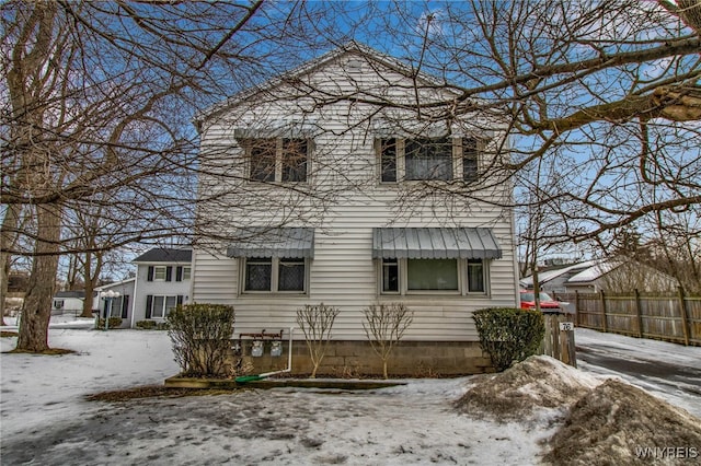 view of front of home with fence