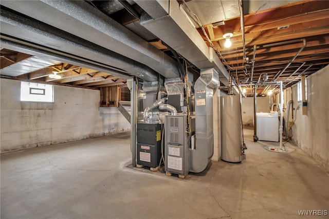 basement with water heater, washer / clothes dryer, and heating unit