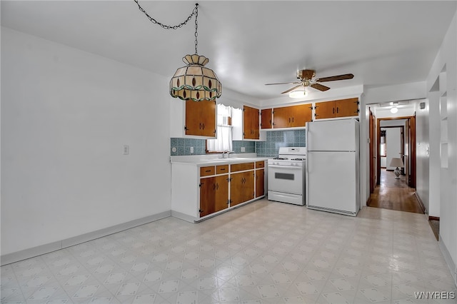 kitchen with white appliances, light countertops, light floors, tasteful backsplash, and brown cabinetry