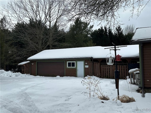 view of snow covered garage