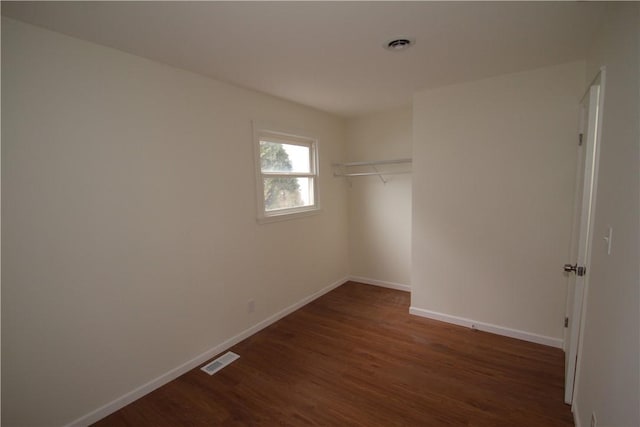 interior space featuring wood finished floors and visible vents