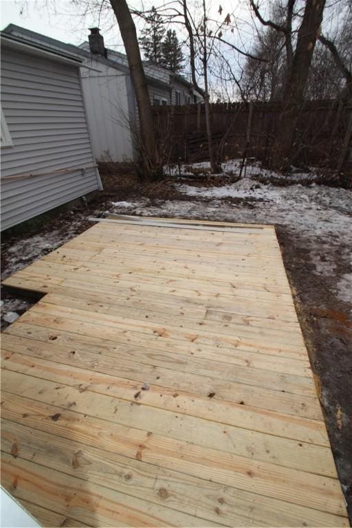 wooden deck featuring fence