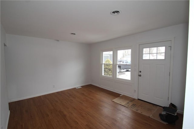 entrance foyer featuring wood finished floors, visible vents, and baseboards