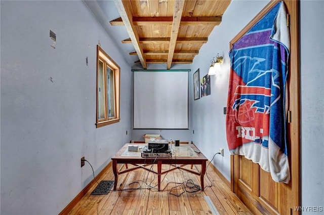 interior space featuring wooden ceiling, light wood-type flooring, beam ceiling, and baseboards