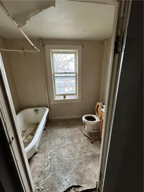 full bath featuring toilet, a soaking tub, and walk in shower