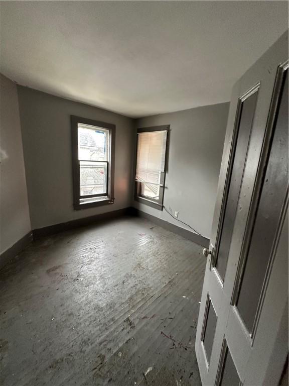 empty room with baseboards